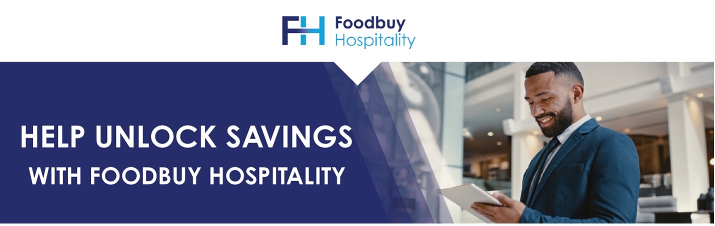 Man in suit smiling and using tablet in modern office. Text reads “Help Unlock Savings with Foodbuy Hospitality.” Man in suit smiling and using tablet in modern office. Text reads “Help Unlock Savings with Foodbuy Hospitality.”